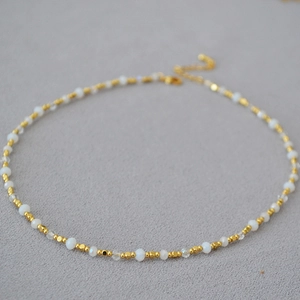 Minimalist beaded gold plated brass necklace with cream white beads and lobster clasp