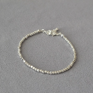 Detailed view of silver irregular cube beads bracelet with adjustable lobster clasp