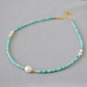 Close-up of mint green amazonite beads with fresh water pearls and gold lobster clasp