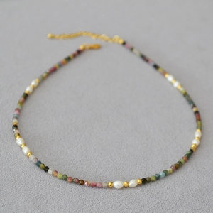 Detail of colorful tourmaline stones and freshwater pearls on a vintage choker necklace
