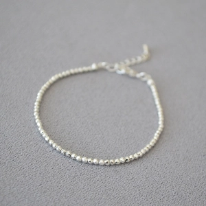 Minimalist faceted silver bead necklace with lobster clasp and extension chain