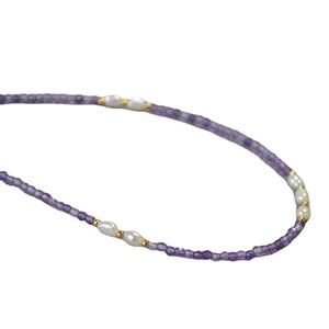 Elegant necklace with lavender amethyst facets, freshwater pearls and gold beads on white