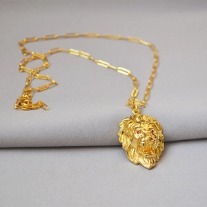 Hip-hop lion head pendant necklace in gold finish with red gemstone eyes and chunky link chain
