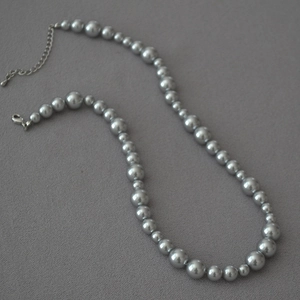 Silver grey faux pearl necklace with alternating bead sizes and lobster clasp detail