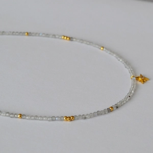Minimalist grey moonstone beaded necklace with delicate gold star pendant for women