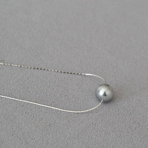 Minimalist brass gold plated thin chain necklace with a grey round imitation pearl pendant