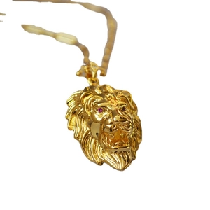 Gothic gold lion head pendant necklace with red crystal eyes and detailed metal mane