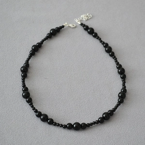 Elegant beaded necklace with black onyx stones and adjustable silver lobster clasp closure