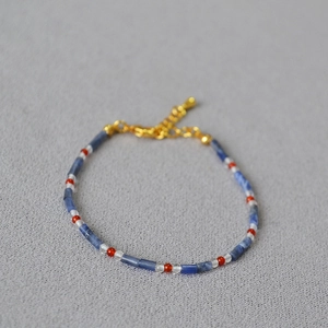 Macro detail of natural stone beads with freshwater pearls and gold lobster clasp
