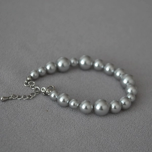 Detail of silver grey gradient pearl bracelet with adjustable metal lobster clasp