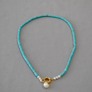 Baroque pearl pendant necklace with turquoise beads and gold spring clasp closure
