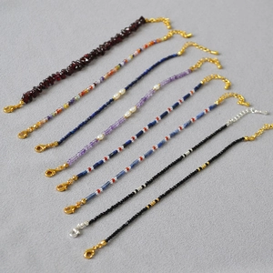 Detailed collection of colorful gemstone bead bracelets with freshwater pearls and clasps