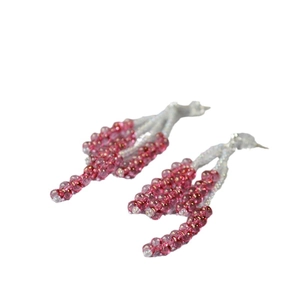Pink crystal beaded hoop earrings with tassel design on a clean white background