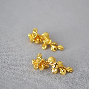 Vintage gold leaf tassel earrings with hammered texture and French floral design