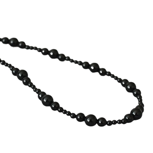 Elegant black onyx beaded necklace with alternating sizes and high polished mirror finish
