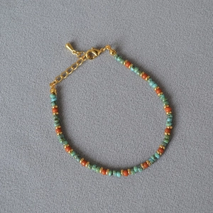 Bracelet rétro perles bohème avec perles turquoise et orange et accents dorés