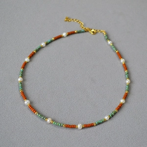 Bohemian freshwater pearl beaded necklace with turquoise and golden accents and extension chain