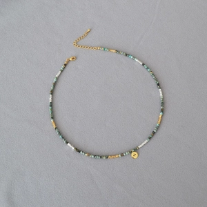 Bohemian turquoise beaded necklace with evil eye pendant and silver-gold accents