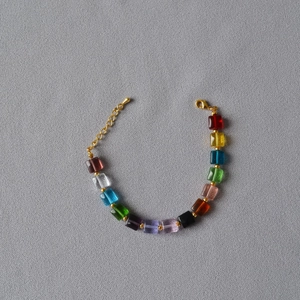 Detailed view of colorful square beads necklace with gold lobster clasp and extension chain