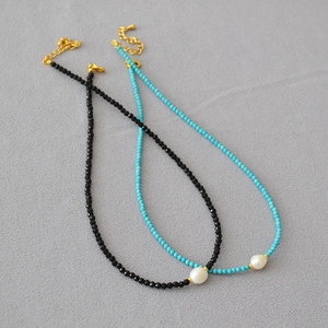 Handmade necklace with black spinel, turquoise beads, and baroque freshwater pearl accent