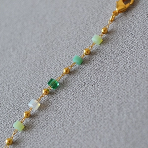 Elegant gold necklace with gradient green and white square beads and lobster clasp