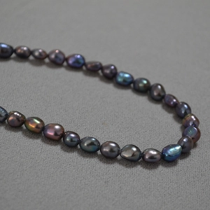 Peacock green baroque pearl necklace with colorful metallic luster and toggle clasp