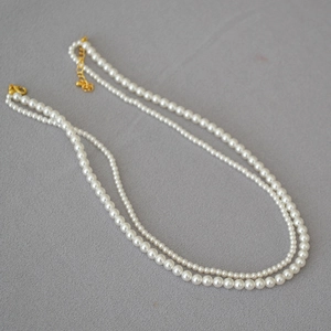 Elegant double layered white pearl necklace with gold clasp and adjustable extender chain