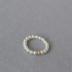 Detail of delicate 14K gold filled bead and dainty white pearls on a slim beaded ring