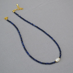 Handmade beaded necklace with blue stones, white baroque pearl, and gold-plated clasp