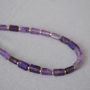 Artistic vintage necklace with faceted purple amethyst stone beads and golden spacers