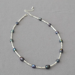 Handmade necklace with irregular crushed silver beads and iridescent baroque Tahitian pearls