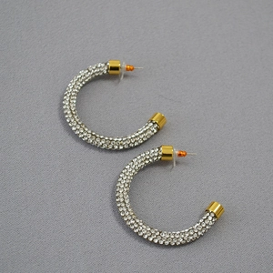 Sparkling gold-plated C-shaped hoop earrings with micro-pave crystal rhinestones