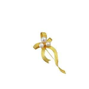 French vintage brass gold-plated brooch with flowy ribbon bow and fresh pearls