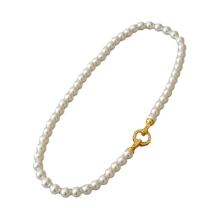 Elegant pearl necklace with a gold clasp encrusted in sparkling cubic zirconia