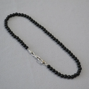 Elegant black onyx bead necklace with minimalist silver U-link chain buckle design