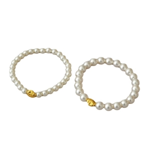 Baroque style white pearl stretch bracelet set with irregular gold metal beads