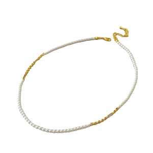 Elegant gold-plated brass necklace with small pearls and a diamond-set gold link detail
