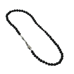 Elegant black onyx beaded necklace with a silver U-shaped clasp on a white background