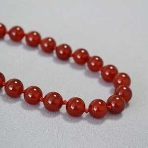 Handcrafted red agate beaded necklace with manual knots and polished round gemstone beads