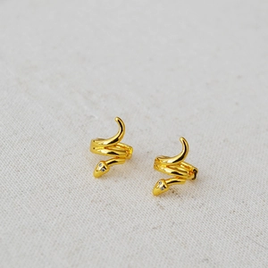 Elegant gold plated brass snake earrings featuring sparkling white zircon stone accents