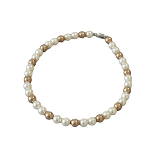 Retro champagne and white pearl necklace with metallic lobster clasp on white background