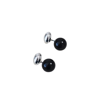 Minimalist silver bead and black agate stud earrings on a clean white background