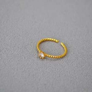 Gold plated twist band adjustable ring with six-prong set cubic zirconia center stone