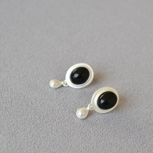 Minimalist silver stud earrings featuring black agate oval stone and silver teardrop charm