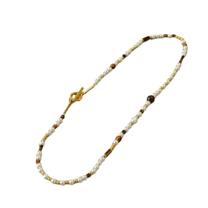 Bohemian pearl and tiger eye beaded necklace with a classic gold-toned toggle clasp