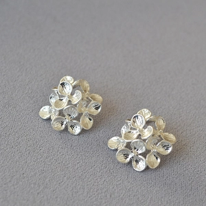 Minimalist silver floral stud earrings with textured layered petals for women