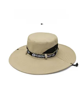 Detail showing the khaki sun hat's wide brim stitching and adjustable chin strap