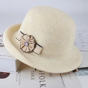 Elegant light beige knit sun hat with floral ribbon decoration and wavy brim for women