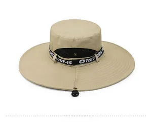 Detail of khaki sun hat with breathable black mesh vents and adjustable chin strap