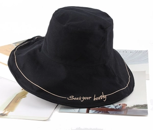 Summer black wide brim bucket hat for women with embroidered Seek Your Beauty text